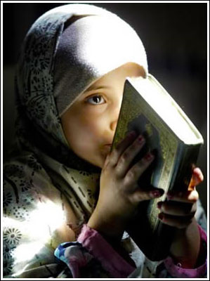 Child reading Quran