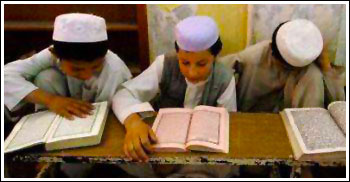 Children studying the Quran